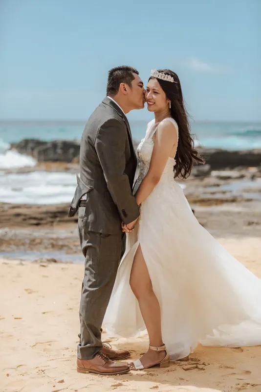 Couple kissing on the shore
